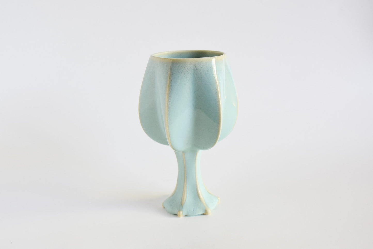 Handmade ceramic kiddush cup titled 'Stemmed Kiddush Cup - Rainbow' – modern Judaica by Feldi Studios
