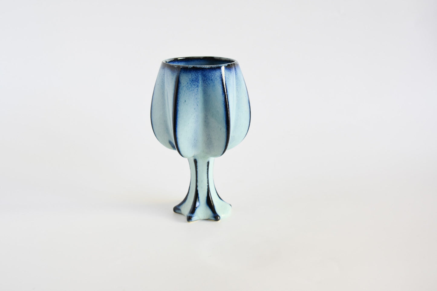 Handmade ceramic kiddush cup titled 'Stemmed Kiddush Cup - Rainbow' – modern Judaica by Feldi Studios