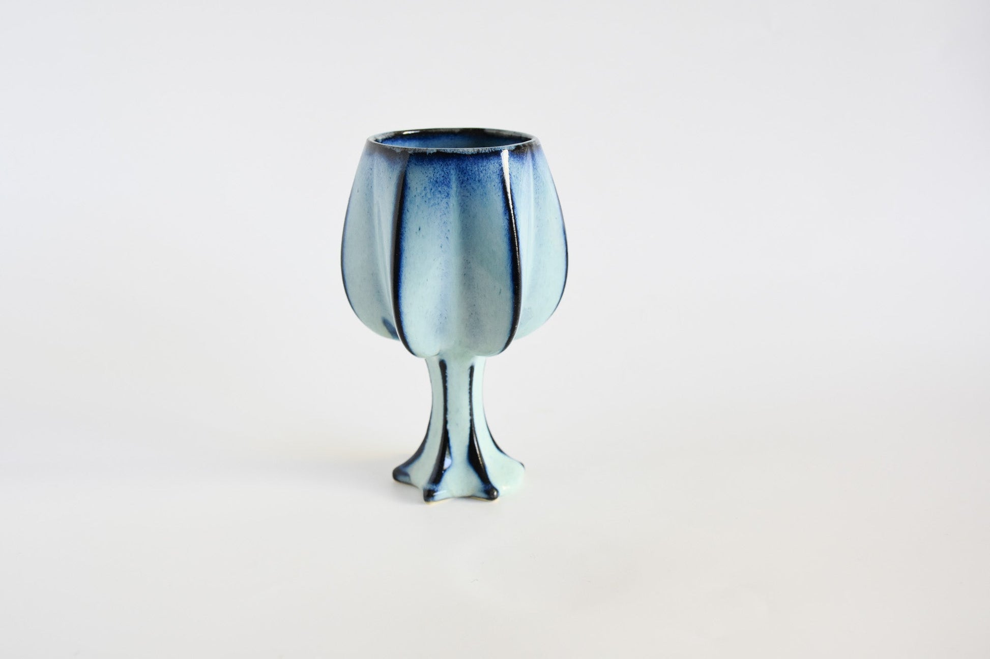 Handmade ceramic kiddush cup titled 'Stemmed Kiddush Cup - Rainbow' – modern Judaica by Feldi Studios