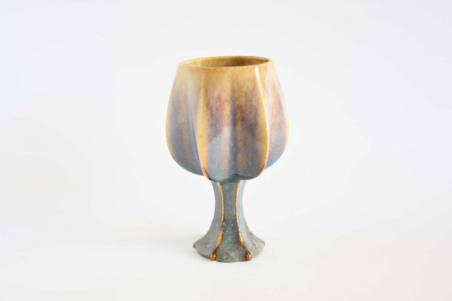 Handmade ceramic kiddush cup titled 'Stemmed Kiddush Cup - Rainbow' – modern Judaica by Feldi Studios