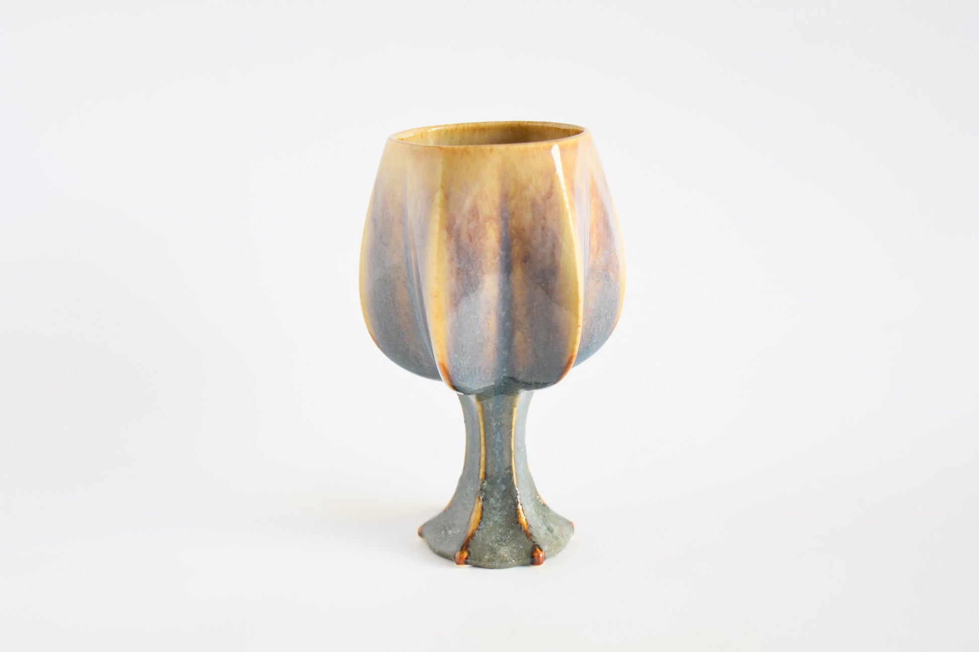 Handmade ceramic kiddush cup titled 'Stemmed Kiddush Cup - Rainbow' – modern Judaica by Feldi Studios