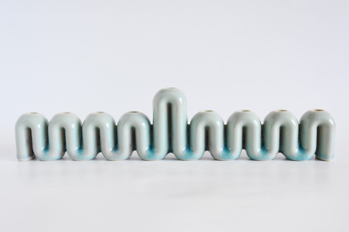 Handmade ceramic menorah titled 'Hanukkah Menorah - Cream | SECOND' – modern Judaica by Feldi Studios