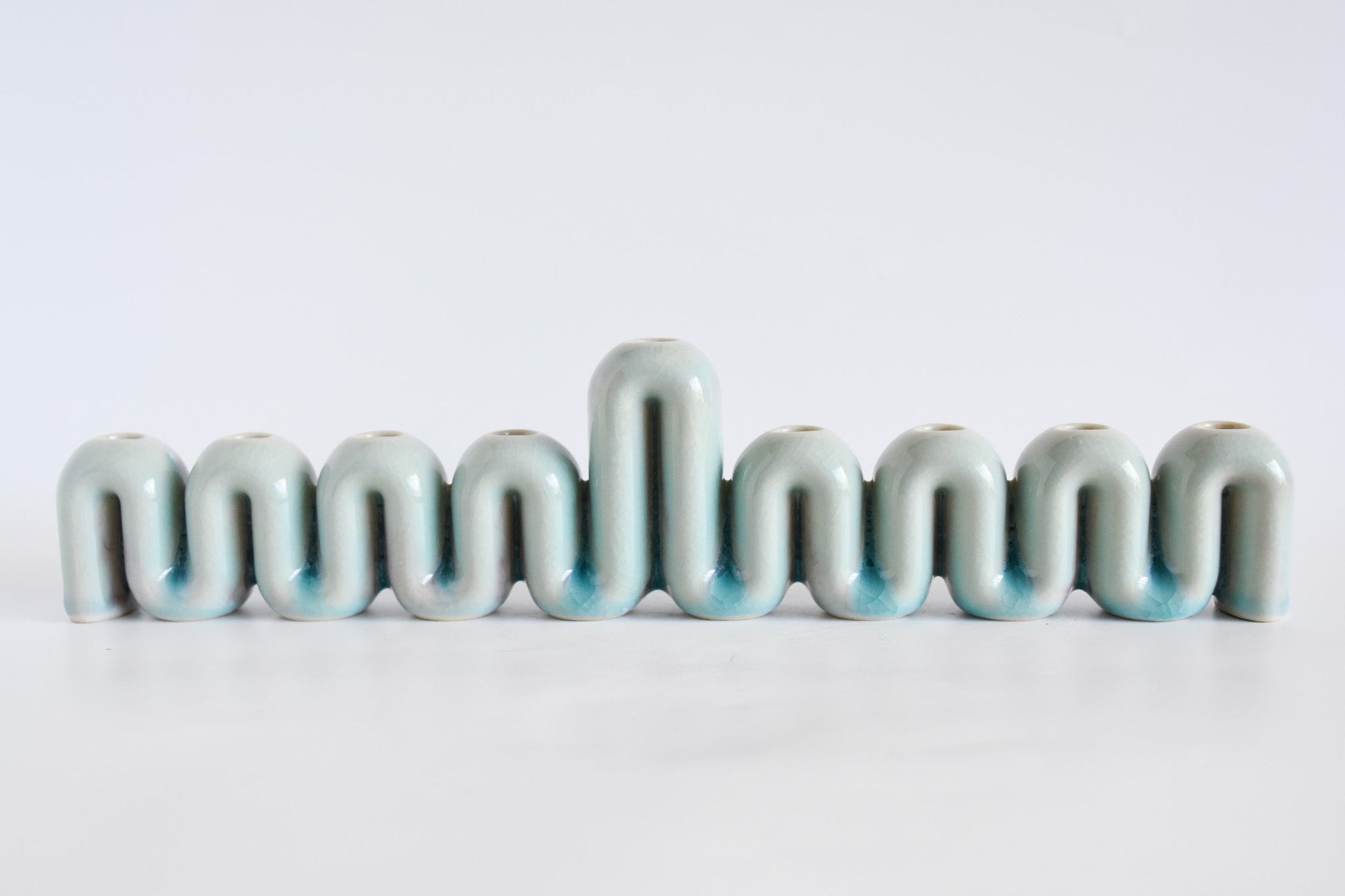 Handmade ceramic menorah titled 'Hanukkah Menorah - Cream | SECOND' – modern Judaica by Feldi Studios
