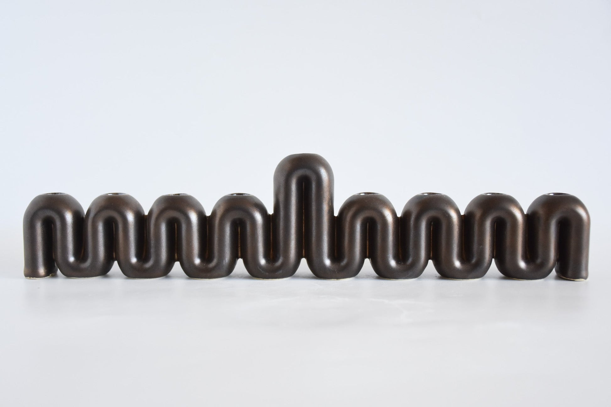 Handmade ceramic menorah titled 'Hanukkah Menorah - Cream | SECOND' – modern Judaica by Feldi Studios