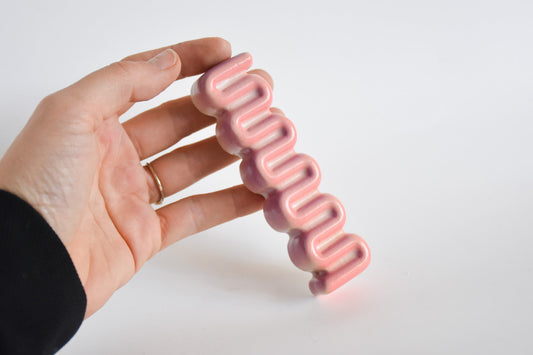 Handmade ceramic mezuzah titled 'Ribbon Mezuzah - Flamingo Fade' – modern Judaica by Feldi Studios