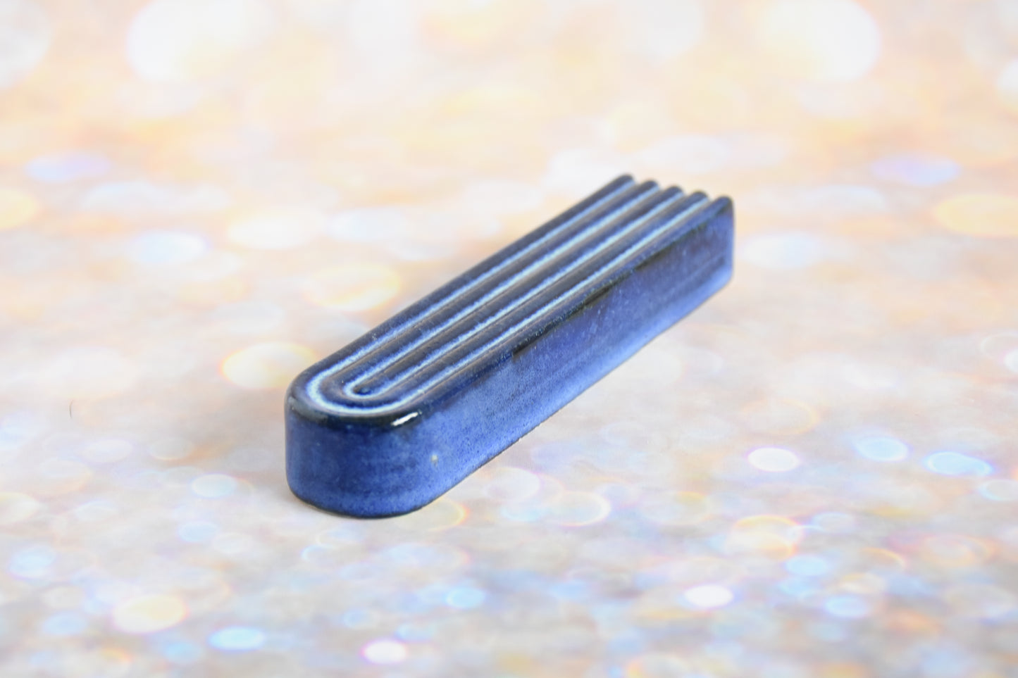 Handmade ceramic mezuzah titled 'Arch Mezuzah - Blue' – modern Judaica by Feldi Studios