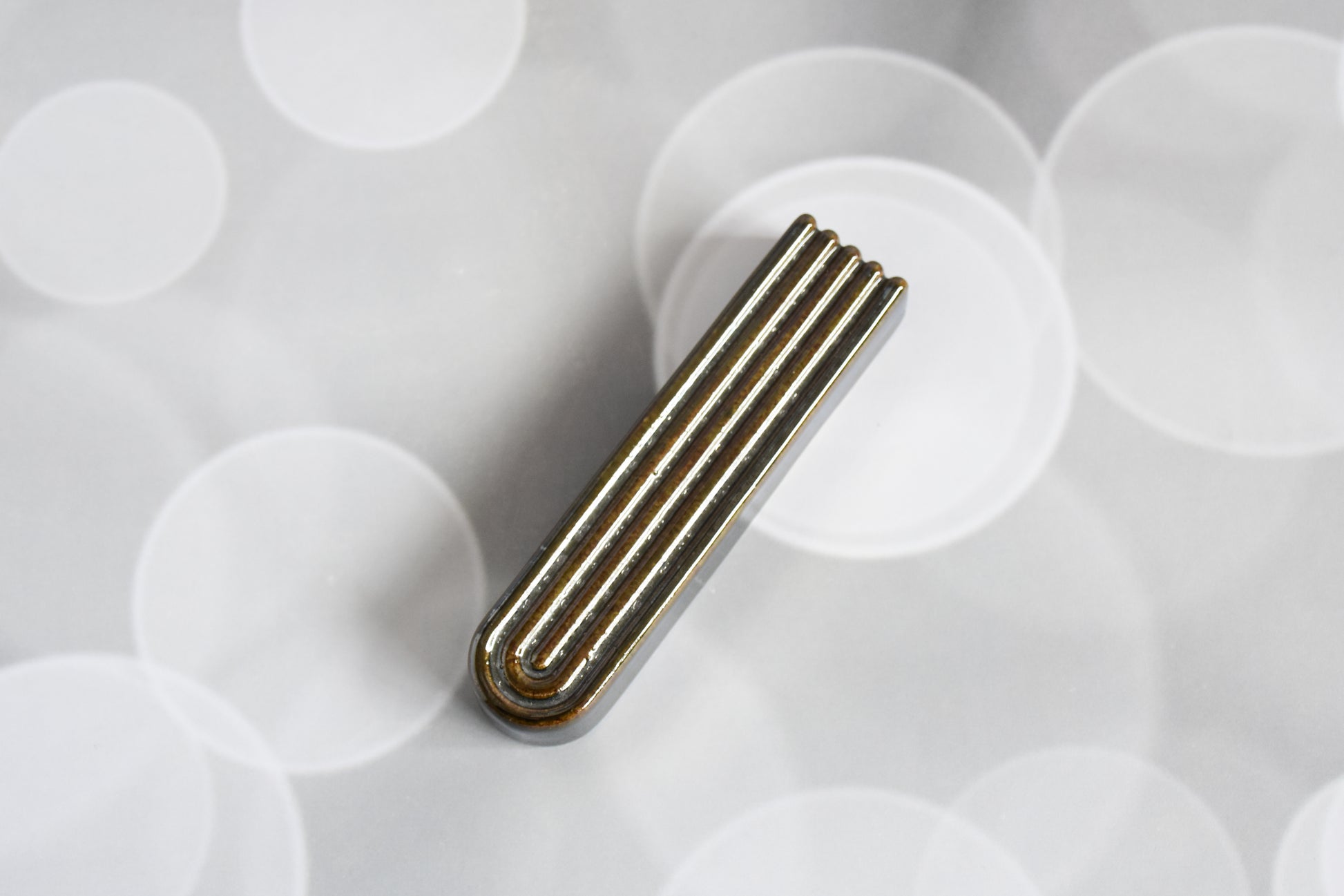 Handmade ceramic mezuzah titled 'Arch Mezuzah - Chrome' – modern Judaica by Feldi Studios