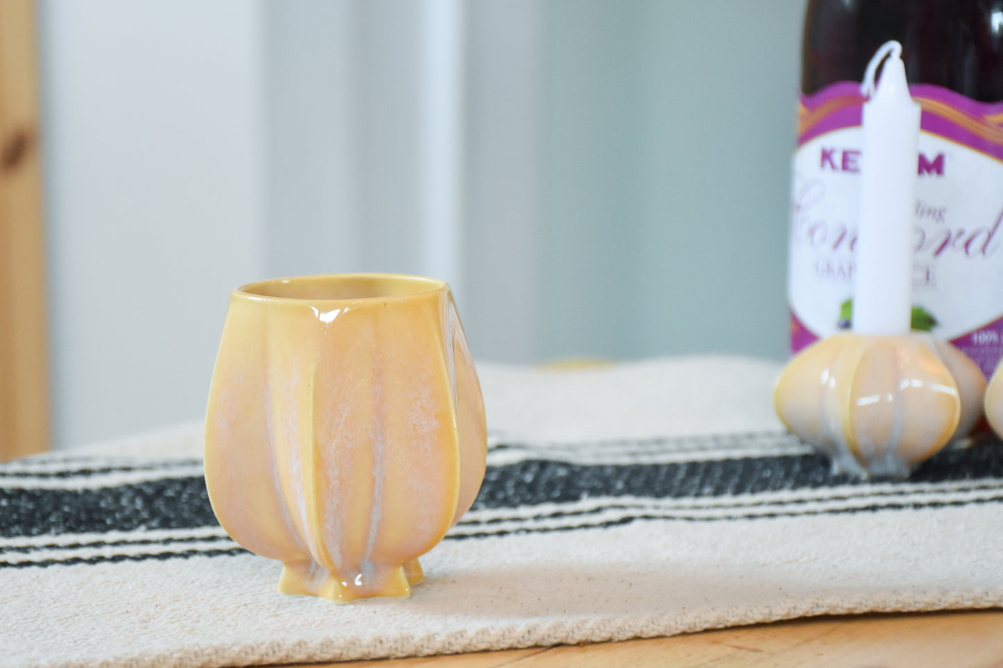 Handmade ceramic kiddush cup titled 'Pom Kiddush Cup - Gold' – modern Judaica by Feldi Studios