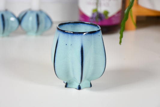 Handmade ceramic kiddush cup titled 'Pom Kiddush Cup - Baby Blue' – modern Judaica by Feldi Studios