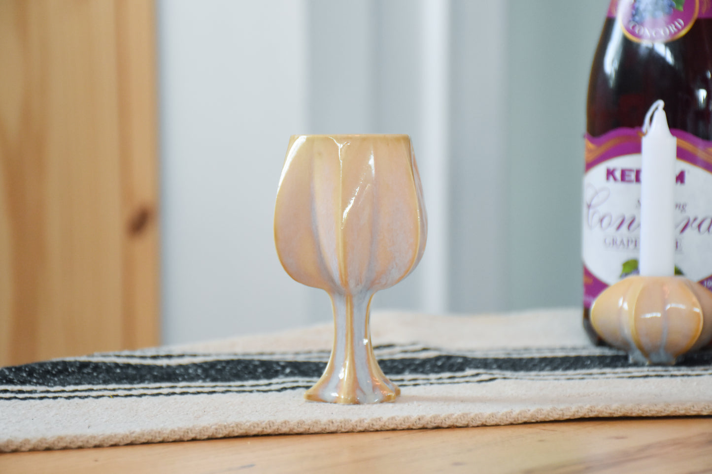 Handmade ceramic kiddush cup titled 'Stemmed Kiddush Cup - Gold' – modern Judaica by Feldi Studios