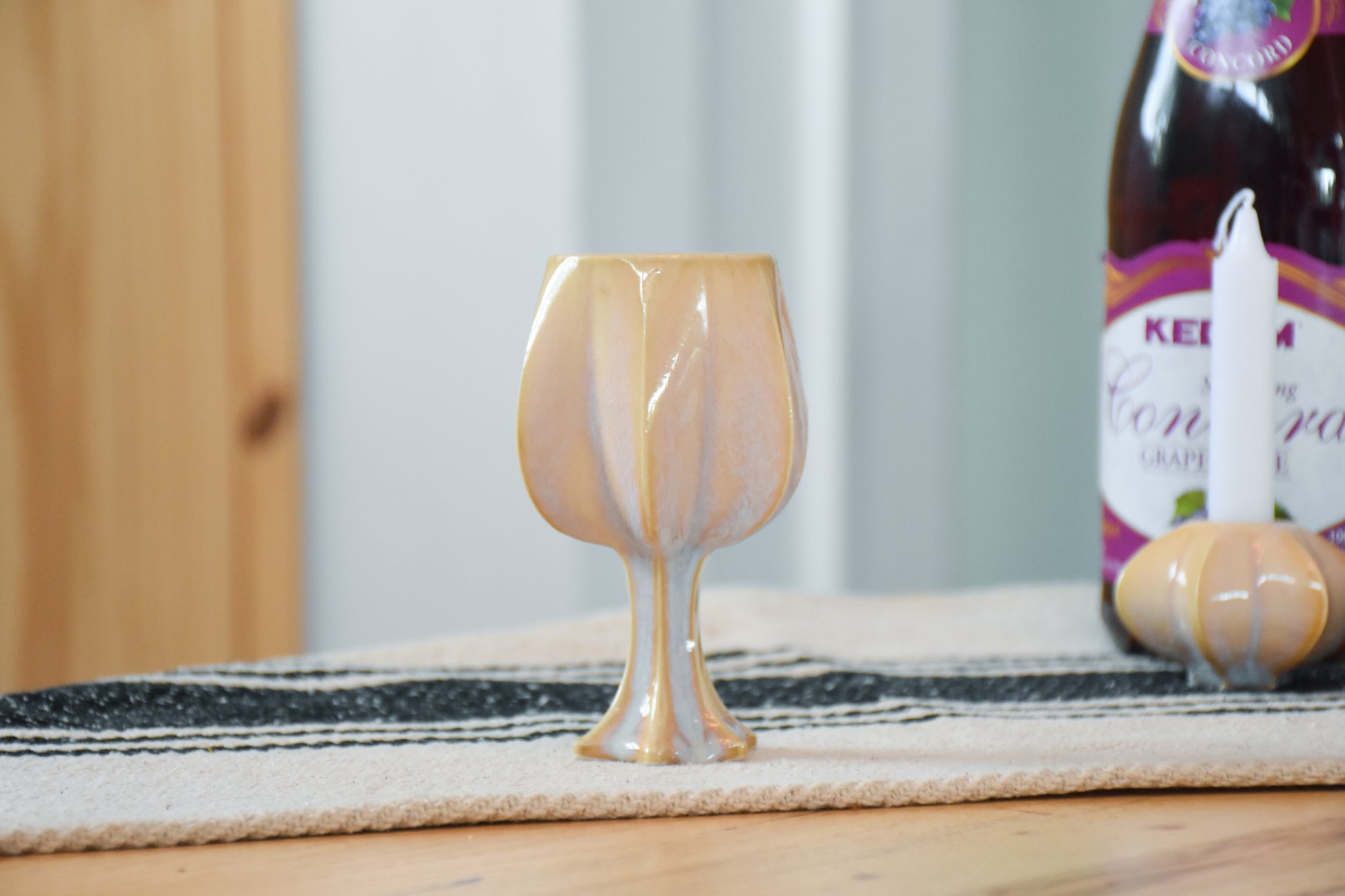 Handmade ceramic kiddush cup titled 'Stemmed Kiddush Cup - Gold' – modern Judaica by Feldi Studios