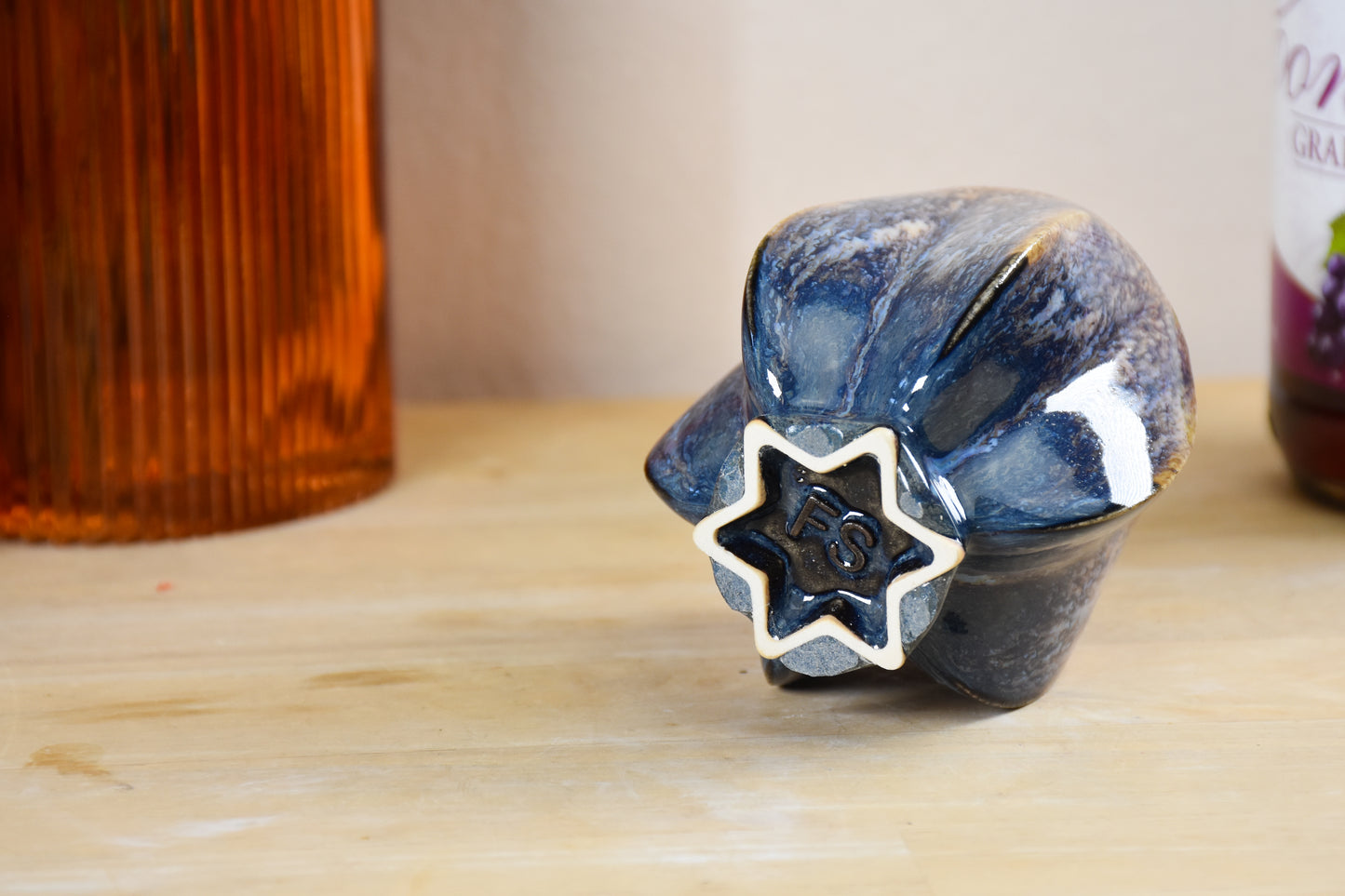 Handmade ceramic shabbat kiddush cup titled 'Pom Kiddush Cup - Gold and Green' – modern Judaica by Feldi Studios