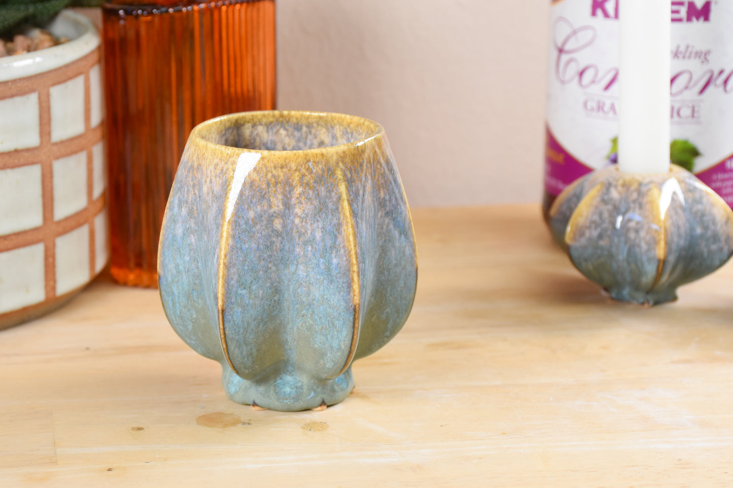 Handmade ceramic kiddush cup titled 'Pom Kiddush Cup - Gold and Green' – modern Judaica by Feldi Studios
