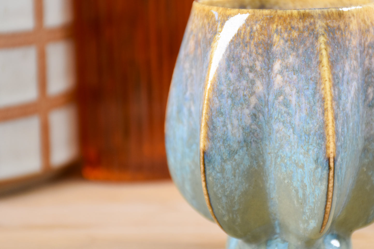 Handmade ceramic kiddush cup titled 'Pom Kiddush Cup - Gold and Green' – modern Judaica by Feldi Studios