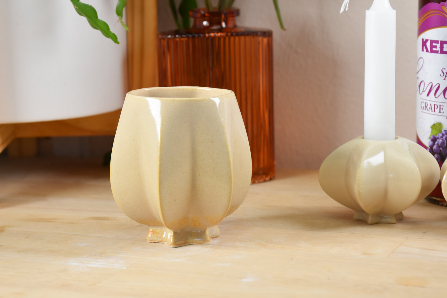 Handmade ceramic shabbat kiddush cup titled 'Pom Kiddush Cup - Almond' – modern Judaica by Feldi Studios