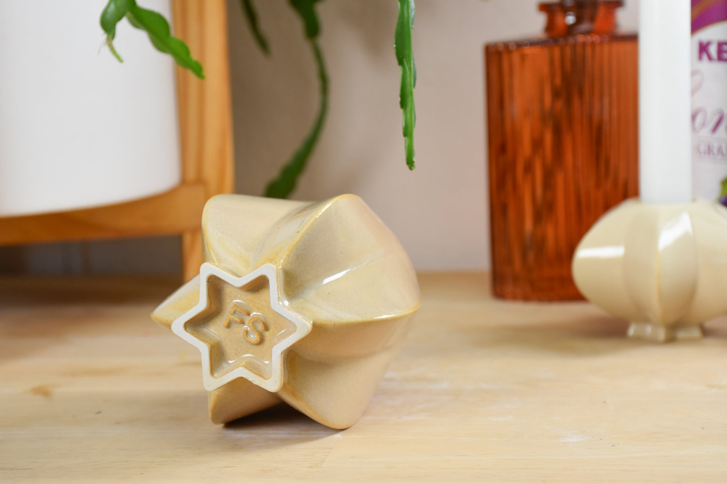 Handmade ceramic shabbat kiddush cup titled 'Pom Kiddush Cup - Almond' – modern Judaica by Feldi Studios