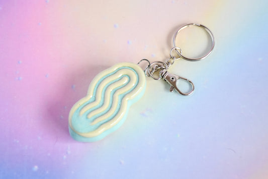 Handmade ceramic accessory titled 'Squigglet Fidget Charm Keychain - Copper' – modern Judaica by Feldi Studios