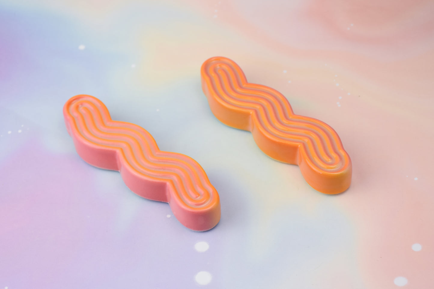 Handmade ceramic mezuzah titled 'Squizuzah Mezuzah - Flamingo Fade' – modern Judaica by Feldi Studios