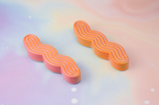 Handmade ceramic mezuzah titled 'Squizuzah Mezuzah - Flamingo Fade' – modern Judaica by Feldi Studios