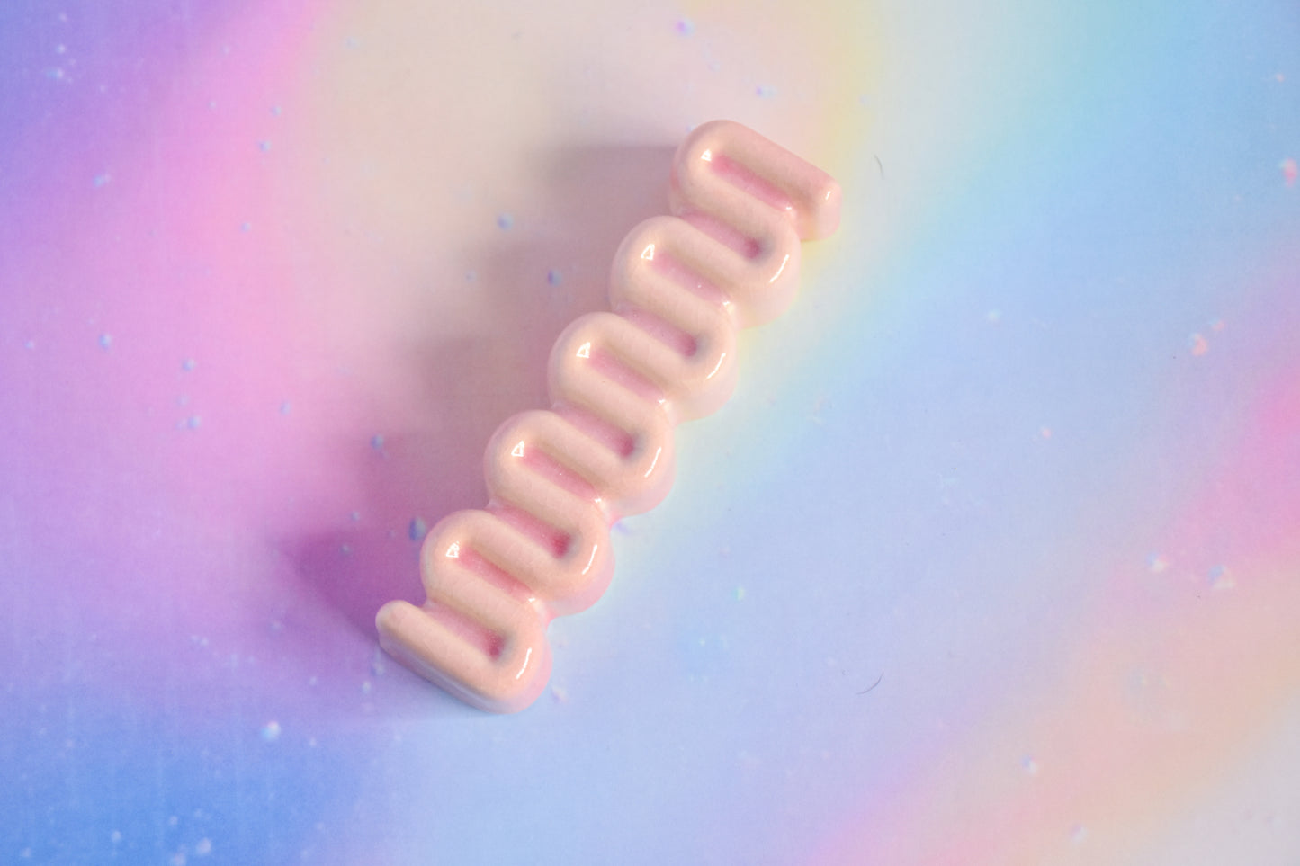 Handmade ceramic mezuzah titled 'Ribbon Mezuzah - Blush Pink' – modern Judaica by Feldi Studios