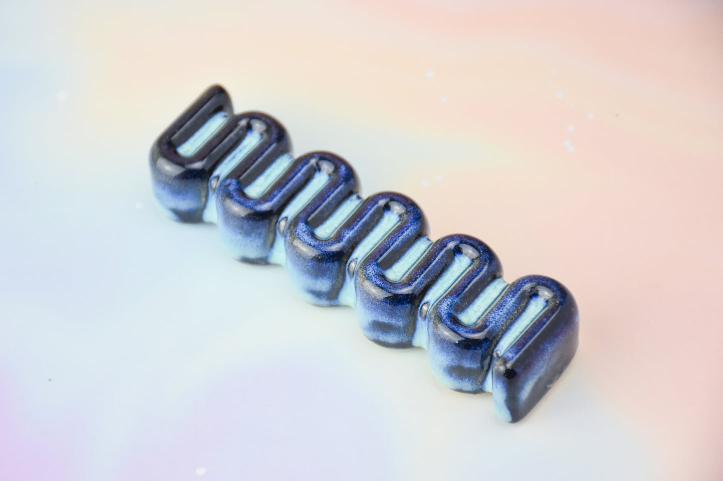 Handmade ceramic mezuzah titled 'Ribbon Mezuzah - Electric Blue' – modern Judaica by Feldi Studios
