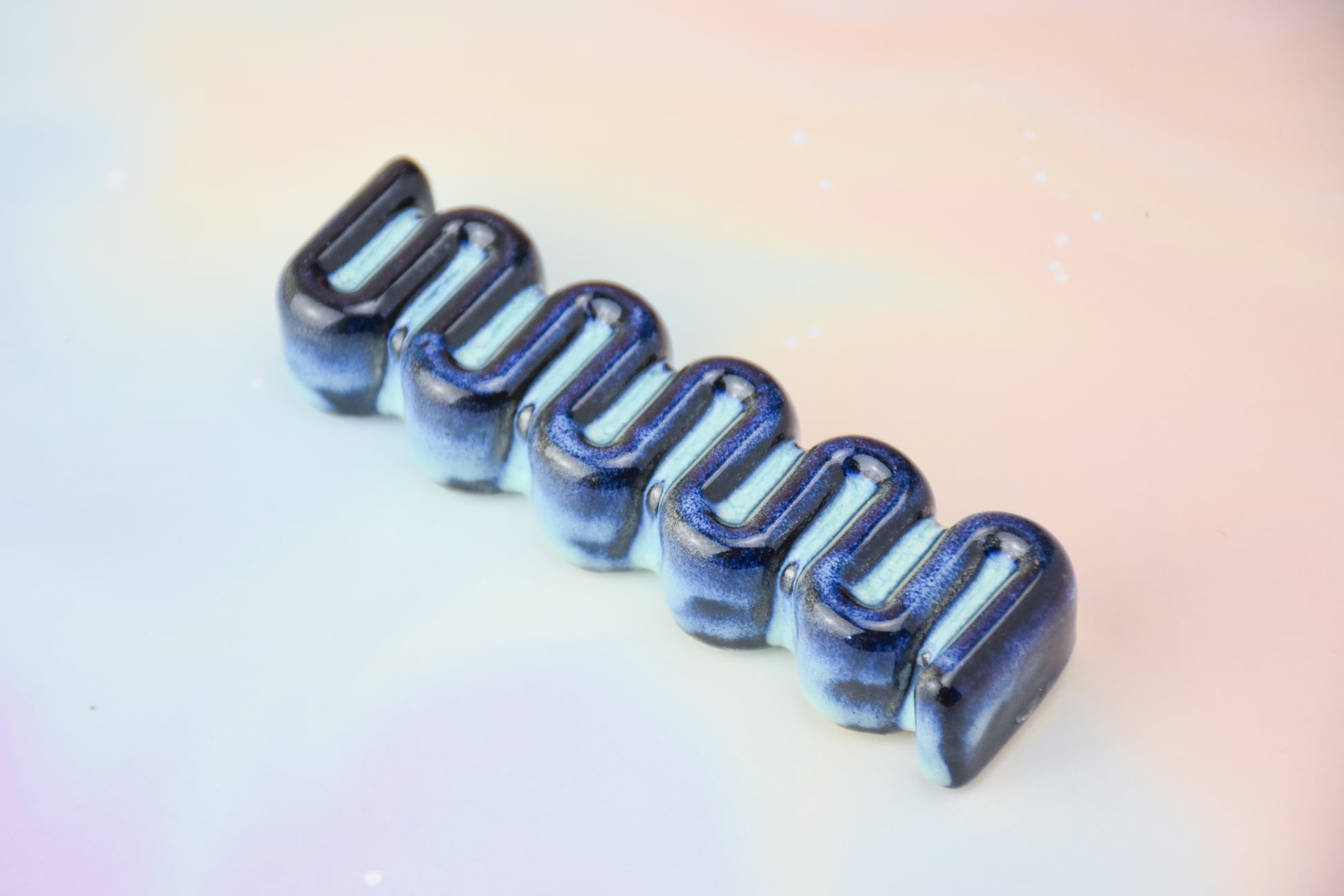 Handmade ceramic mezuzah titled 'Ribbon Mezuzah - Electric Blue' – modern Judaica by Feldi Studios