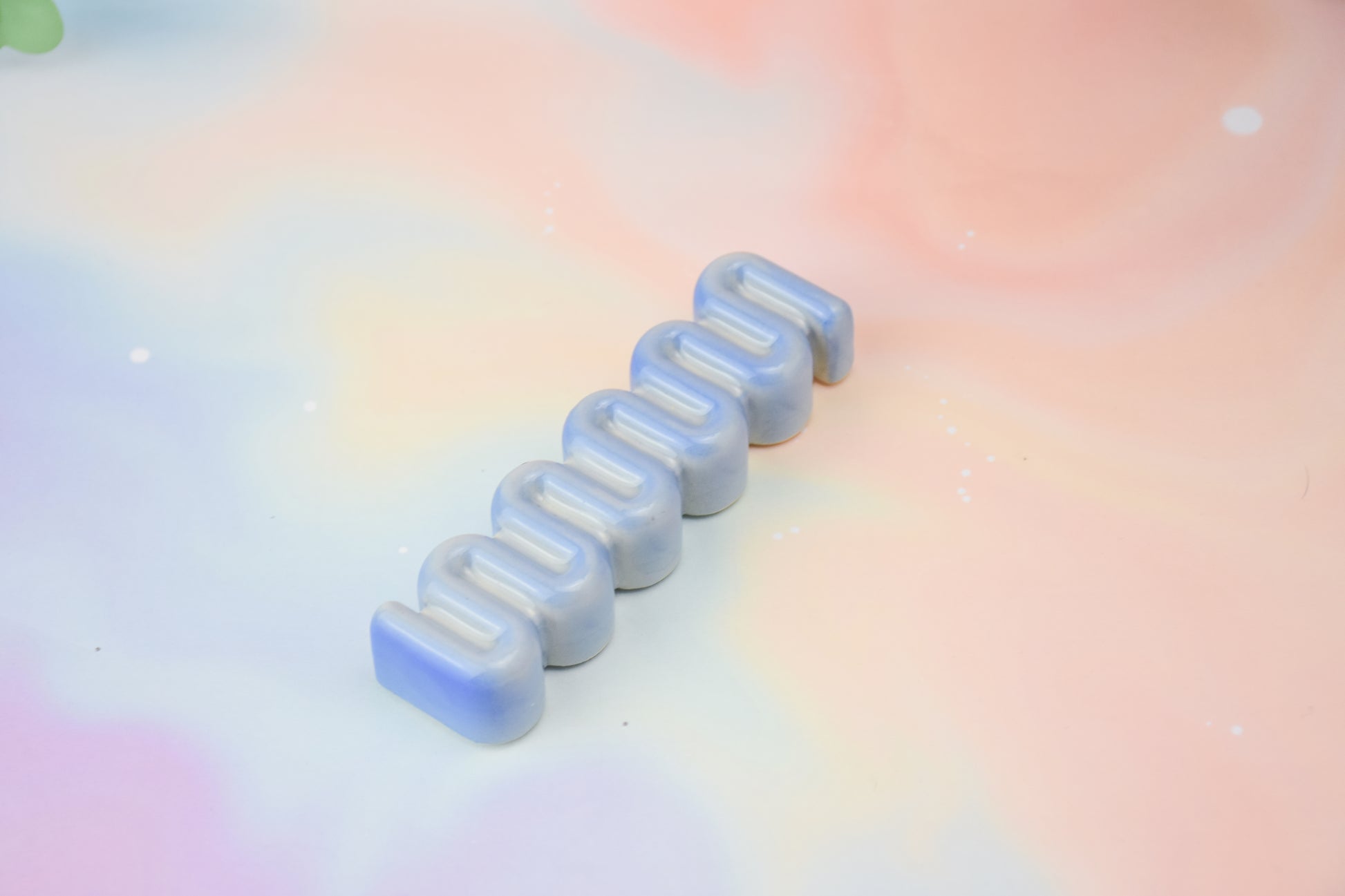 Handmade ceramic mezuzah titled 'Ribbon Mezuzah - Light Blue Fade' – modern Judaica by Feldi Studios