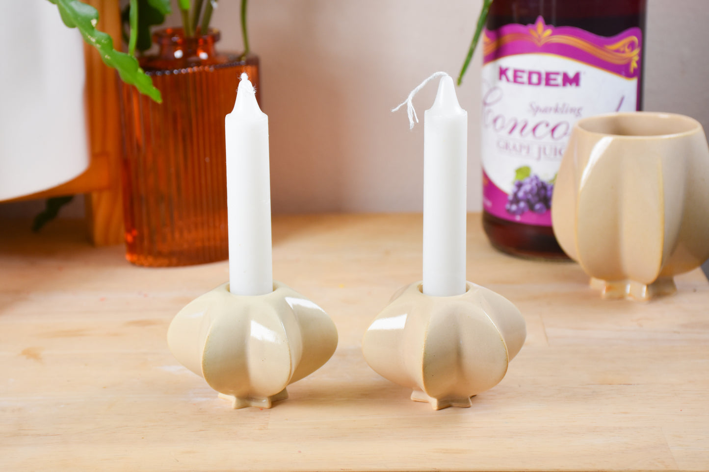 Two jewish star-shaped shabbat candle holders. Handmade ceramic shabbat candle titled 'Shabbat Candle Pair - Almond' – modern Judaica by Feldi Studios
