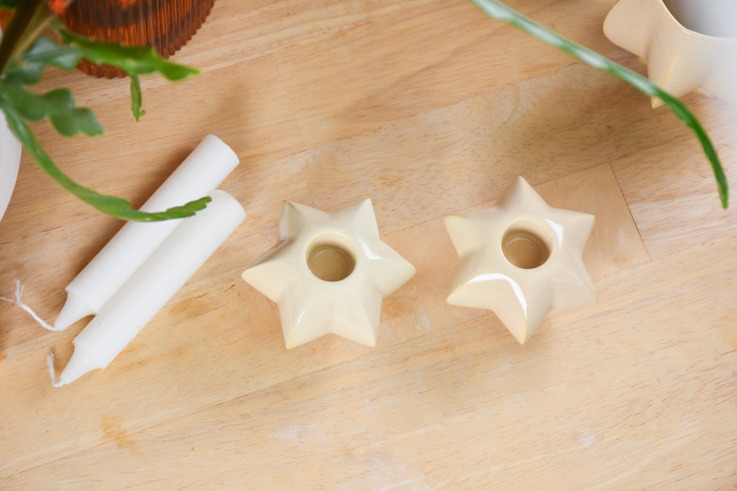 Two jewish star-shaped shabbat candle holders. Handmade ceramic shabbat candle titled 'Shabbat Candle Pair - Almond' – modern Judaica by Feldi Studios