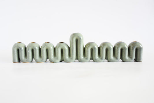 Handmade ceramic menorah titled 'Hanukkah Menorah - Cream | SECOND' â€“ modern Judaica by Feldi Studios