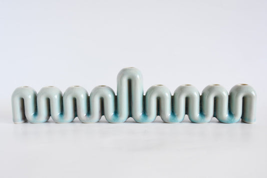Handmade ceramic menorah titled 'Hanukkah Menorah - Cream | SECOND' â€“ modern Judaica by Feldi Studios