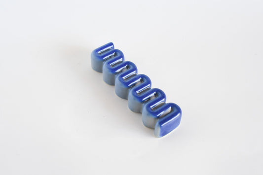 Handmade ceramic mezuzah titled 'Ribbon Mezuzah - Flamingo Fade' – modern Judaica by Feldi Studios