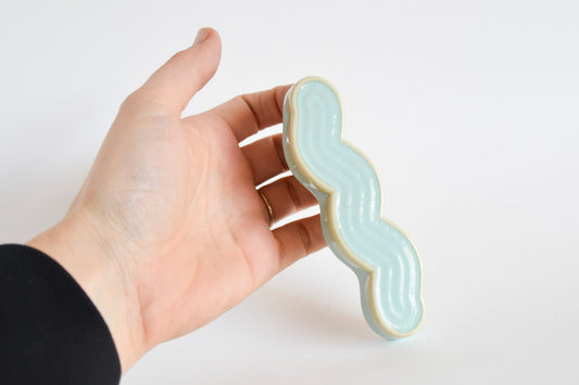 Handmade ceramic mezuzah titled 'Squizuzah Mezuzah - Princess Fade' â€“ modern Judaica by Feldi Studios