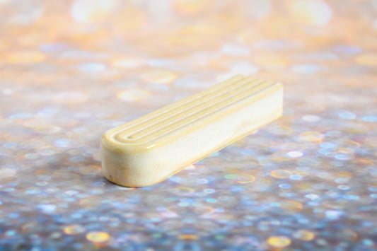 Handmade ceramic mezuzah titled 'Arch Mezuzah - Cream' – modern Judaica by Feldi Studios