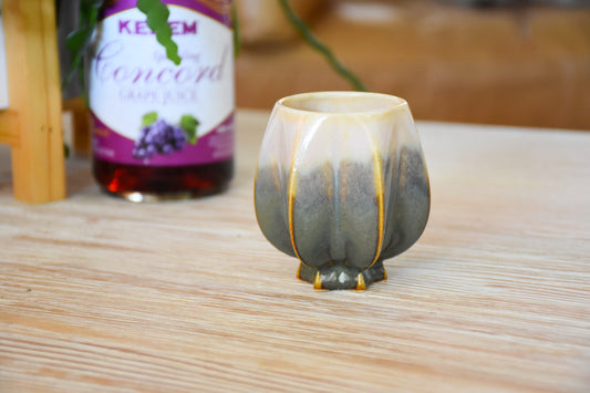 Handmade ceramic kiddush cup titled 'Pom Kiddush Cup - Peaches and Green' – modern Judaica by Feldi Studios