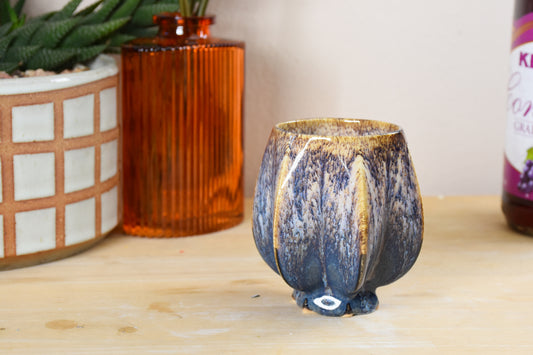 Handmade ceramic shabbat kiddush cup titled 'Pom Kiddush Cup - Gold and Green' – modern Judaica by Feldi Studios
