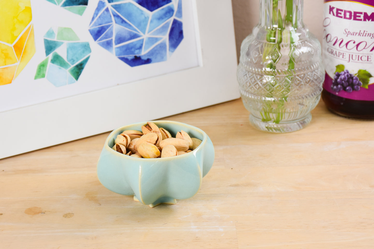 Pom honey pot holding nuts showing versatility of the bowl