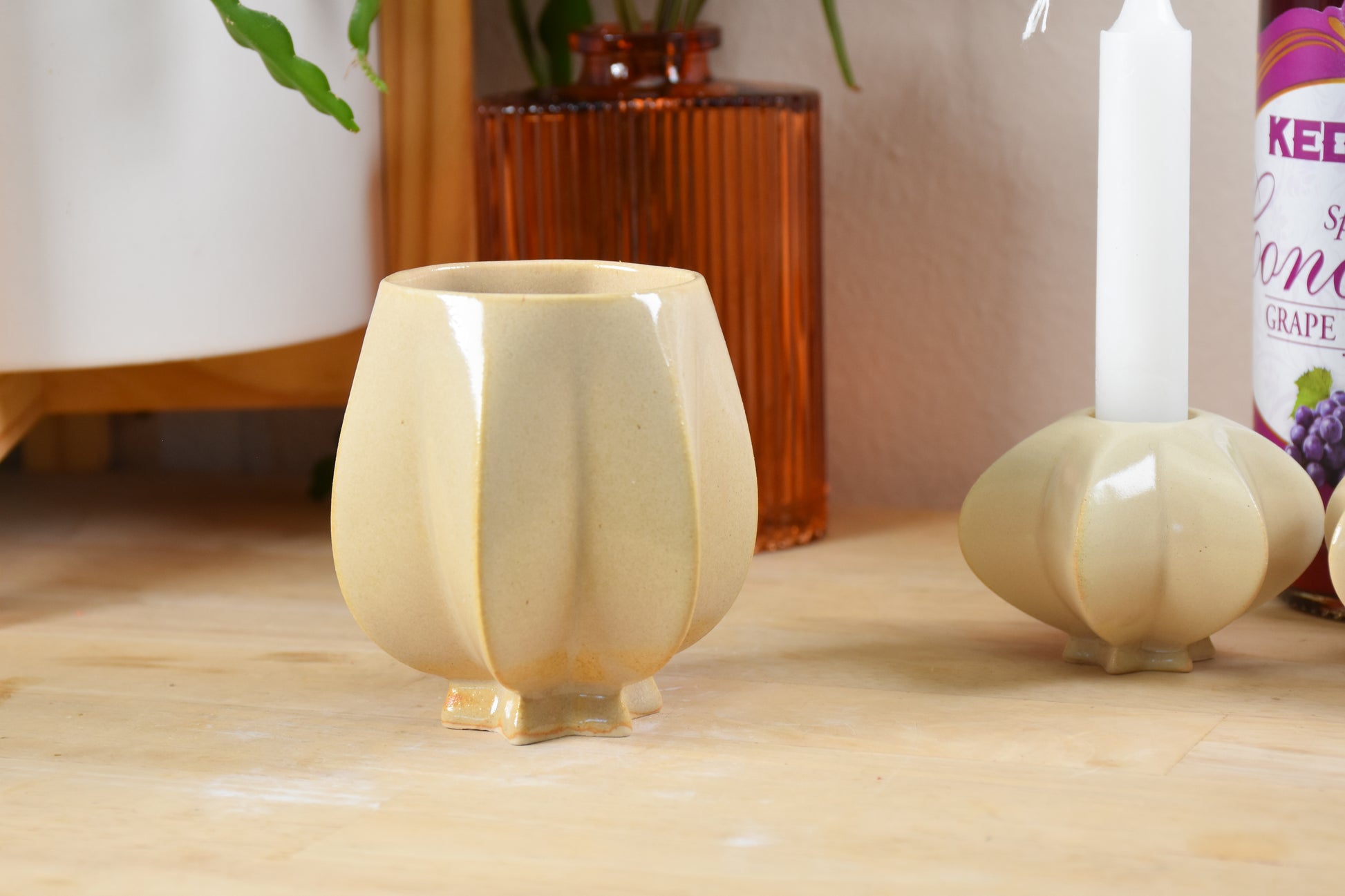 Handmade ceramic shabbat kiddush cup titled 'Pom Kiddush Cup - Almond' – modern Judaica by Feldi Studios