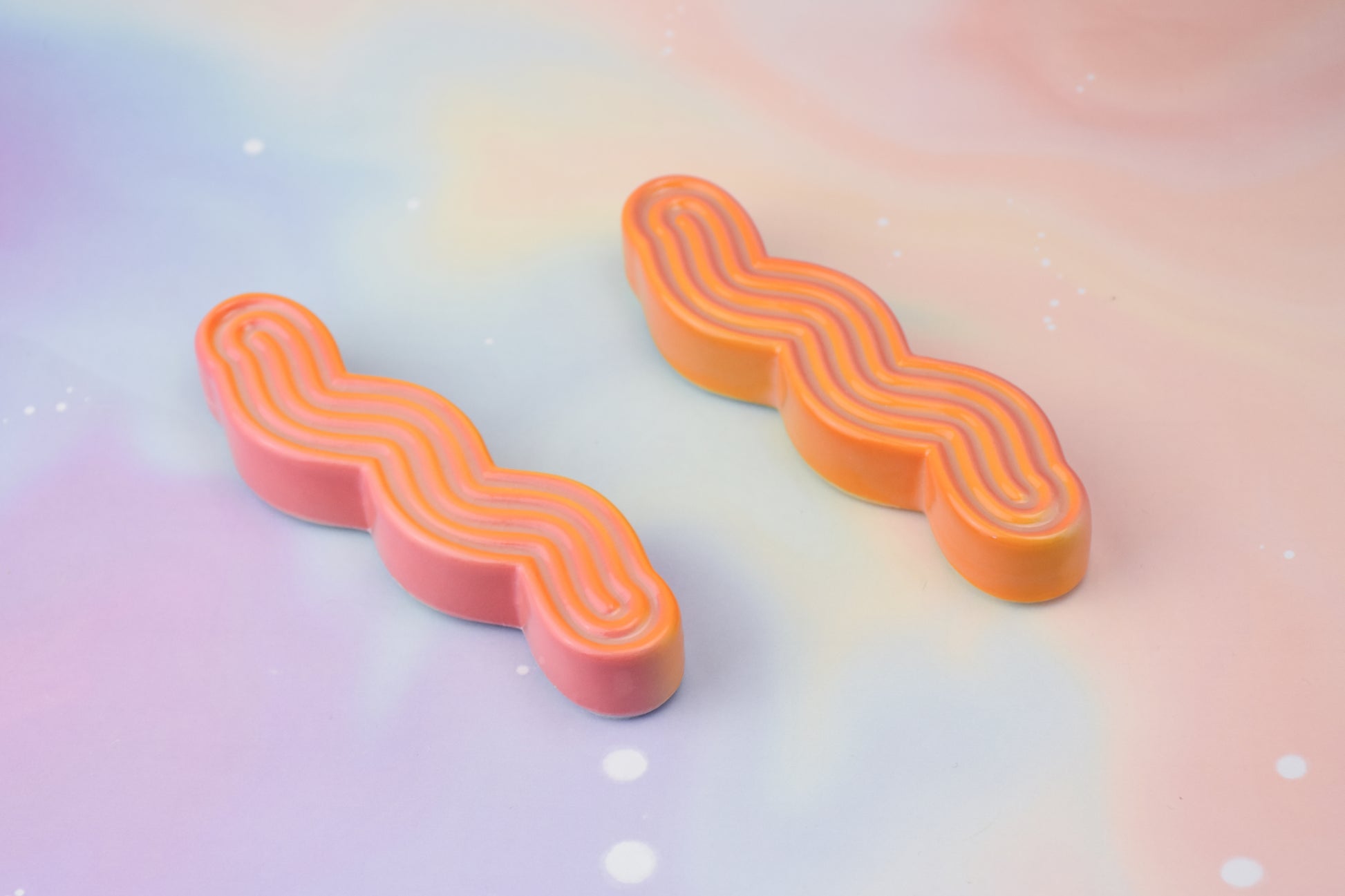 Handmade ceramic mezuzah titled 'Squizuzah Mezuzah - Flamingo Fade' – modern Judaica by Feldi Studios