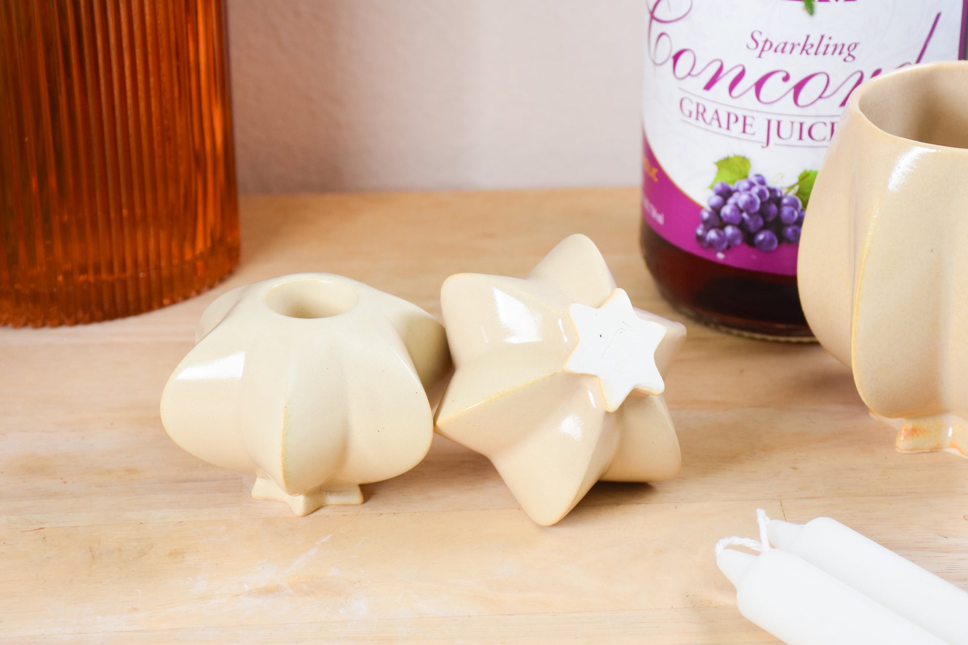 Two jewish star-shaped shabbat candle holders. Handmade ceramic shabbat candle titled 'Shabbat Candle Pair - Almond' – modern Judaica by Feldi Studios